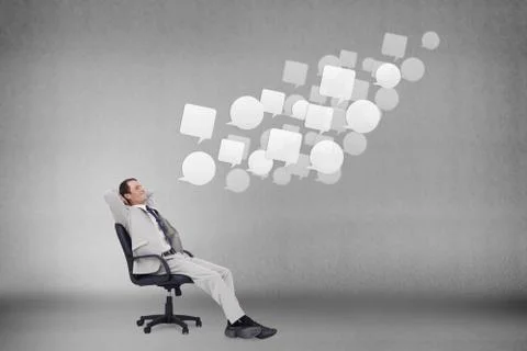 Composite image of side view of businessman leaning back in his chair Illustrazione stock