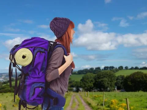 Composite image of side view of a hipster woman with a travel bag Foto stock