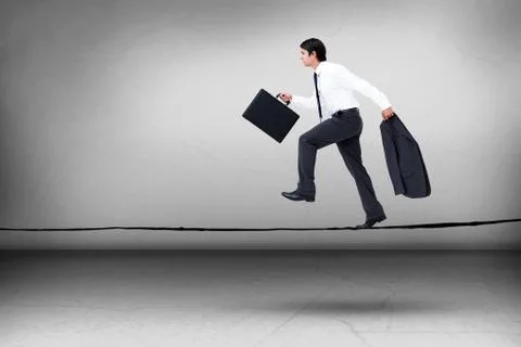 Composite image of side view of walking tradesman with jacket and suitcase Stock Photos
