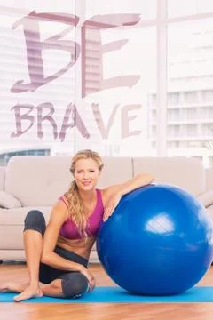 Composite image of slim blonde sitting beside exercise ball smiling at camera 스톡 일러스트