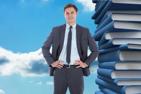 Composite image of smiling businessman with hands on hips Illustrazione stock