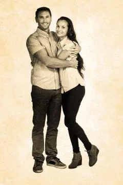 Composite image of smiling couple hugging and looking at camera Stock Photos