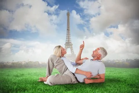 Composite image of smiling couple lying and looking up Fotos Stock