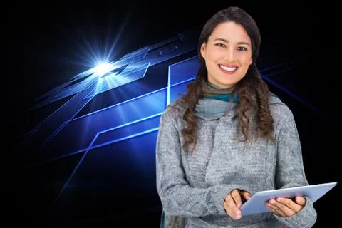 Composite image of smiling model wearing winter clothes holding her tablet Stock Illustration