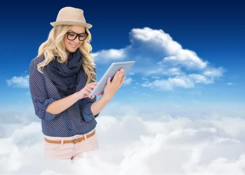 Composite image of smiling trendy blonde using tablet computer Stock Illustration