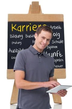 Composite image of smiling young man with tablet computer Illustrazione stock