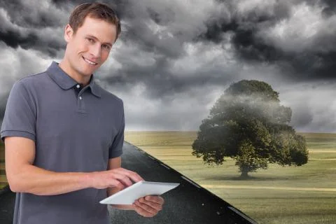 Composite image of smiling young man with tablet computer Stockillustratie