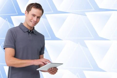 Composite image of smiling young man with tablet computer Stock Illustration