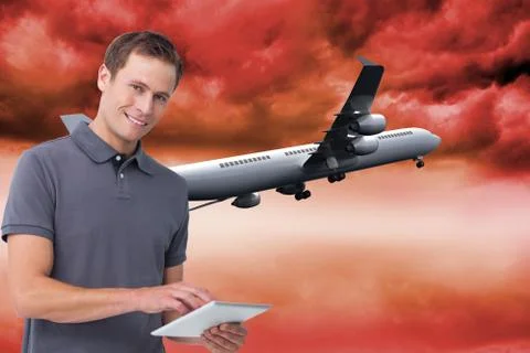 Composite image of smiling young man with tablet computer Illustrazione stock