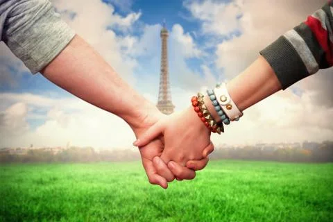 Composite image of students holding hands Fotos Stock