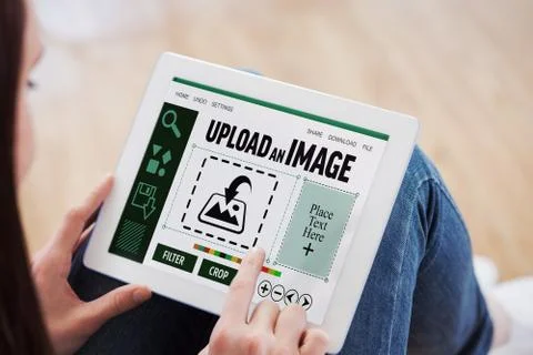Composite image of teen using a tablet pc sitting on the floor Stock Photos