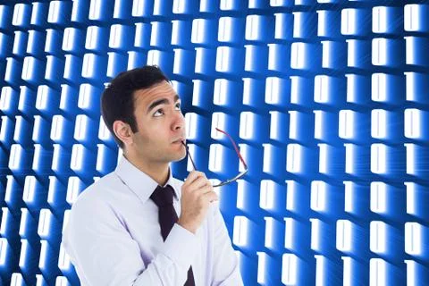 Composite image of thinking businessman holding glasses Illustrazione stock