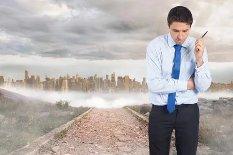 Composite image of thinking businessman holding pen Stock Illustration