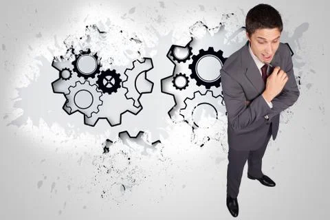 Composite image of thinking businessman holding pen イラスト素材