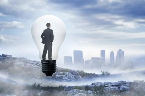 Composite image of thinking businessman in light bulb 스톡 일러스트