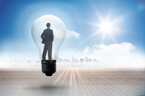 Composite image of thinking businessman in light bulb Illustrazione stock