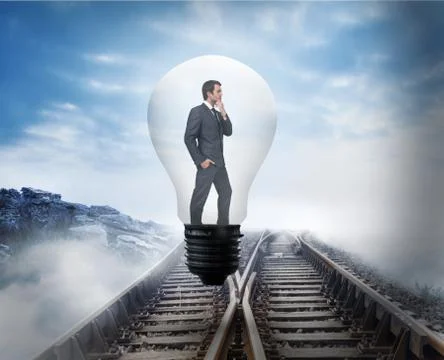 Composite image of thinking businessman in light bulb Illustrazione stock