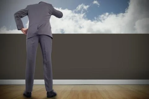 Composite image of thinking businessman scratching head Illustrazione stock