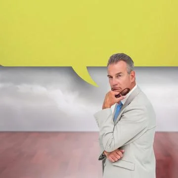 Composite image of thinking businessman with speech bubble Illustrazione stock