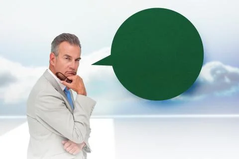 Composite image of thinking businessman with speech bubble Illustrazione stock