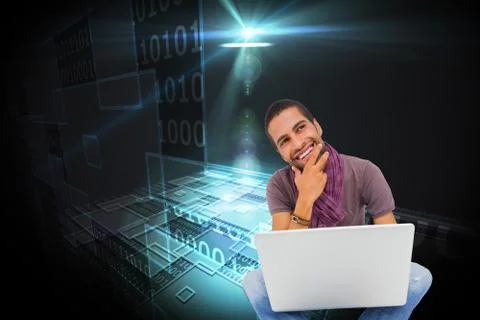 Composite image of thinking man sitting on floor using laptop and smiling Illustrazione stock