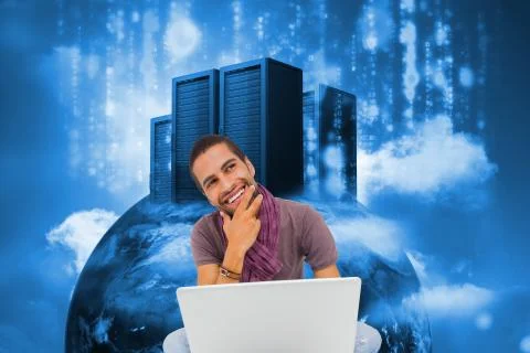 Composite image of thinking man sitting on floor using laptop and smiling Illustrazione stock