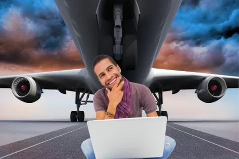 Composite image of thinking man sitting on floor using laptop and smiling Stock Illustration
