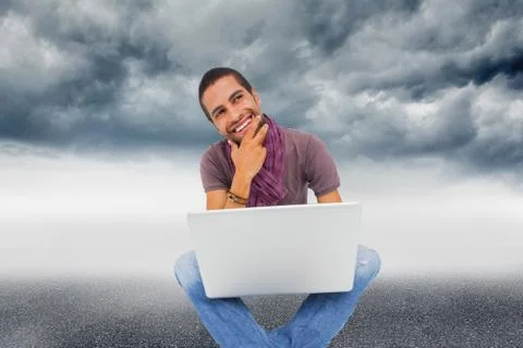 Composite image of thinking man sitting on floor using laptop and smiling Stock Illustration