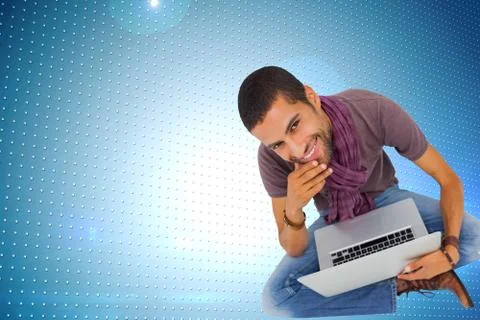 Composite image of thoughtful man sitting on floor using laptop and smiling at Stock Illustration