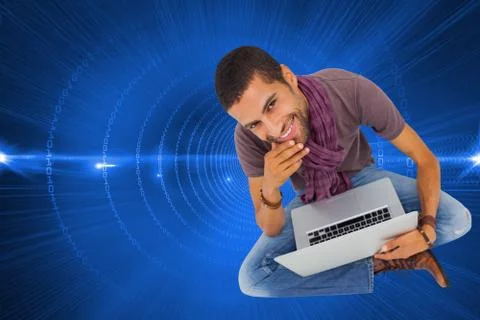 Composite image of thoughtful man sitting on floor using laptop and smiling at Stock Illustration