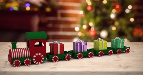 Composite image of train model carrying gift boxes 스톡 일러스트