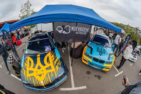 A composite image of two outdoor event photos shows a customized blue car w.. Stock Photos