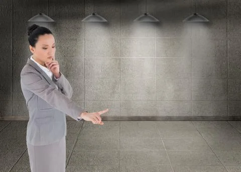 Composite image of unsmiling thinking asian businesswoman pointing Stock Illustration