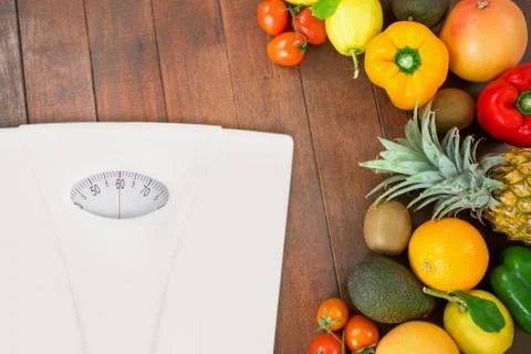 Composite image of weighting scale Stock Photos