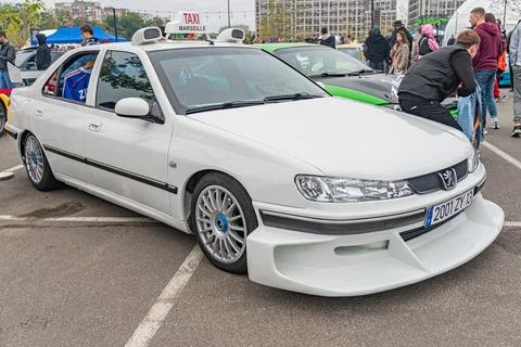 A composite image of a white racing hatchback, likely a Honda Integra or Civi Stock Photos