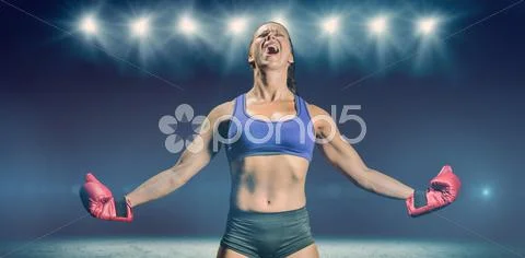 Composite image of winning fighter with arms outstretched Stock Photos