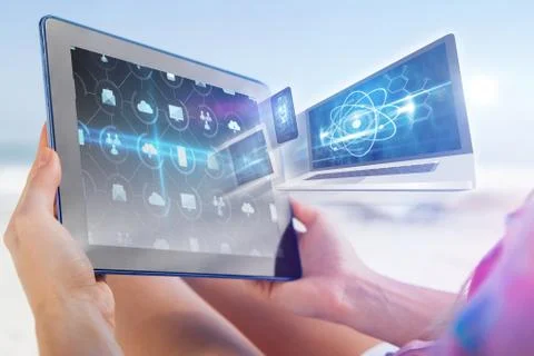 Composite image of woman sitting on beach in deck chair using tablet pc イラスト素材