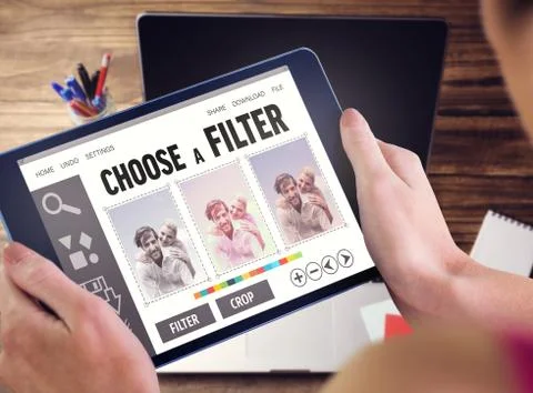 Composite image of woman using tablet pc Fotos de archivo