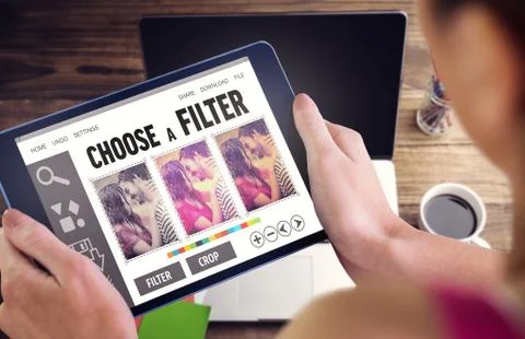 Composite image of woman using tablet pc Fotos de archivo