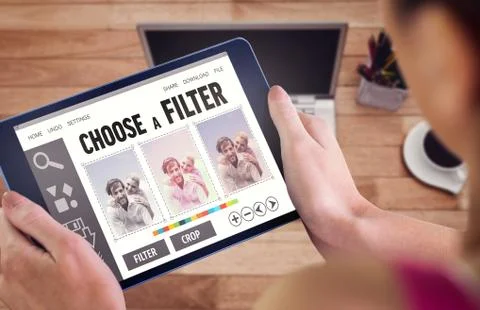 Composite image of woman using tablet pc Fotos de archivo