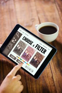 Composite image of woman using tablet pc Fotos de archivo