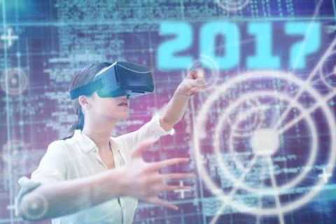 Composite image of woman using a virtual reality device Stock Photos