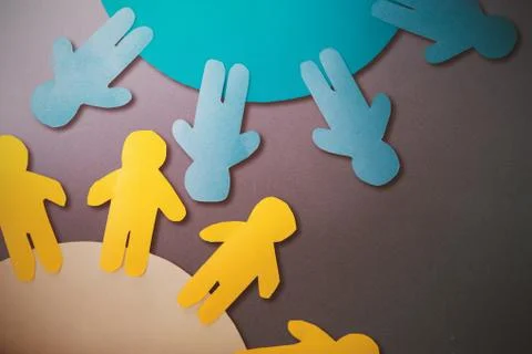 Composite image of yellow and blue little person on circle Illustrazione stock gratuita