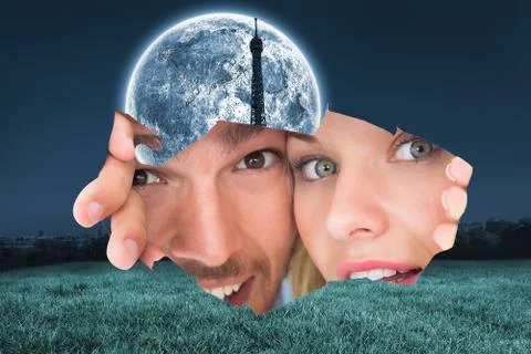 Composite image of young couple peeking through torn paper イラスト素材