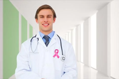 Composite image of young doctor using tablet pc Stock Photos