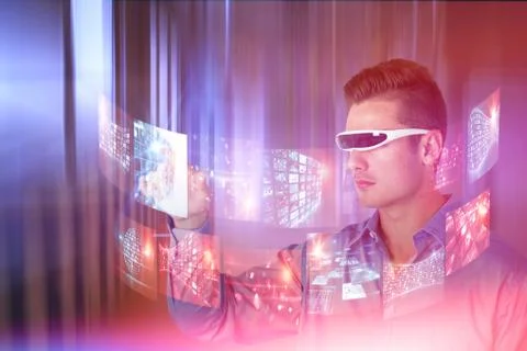 Composite image of young man pointing while using virtual video glasses Stock Photos