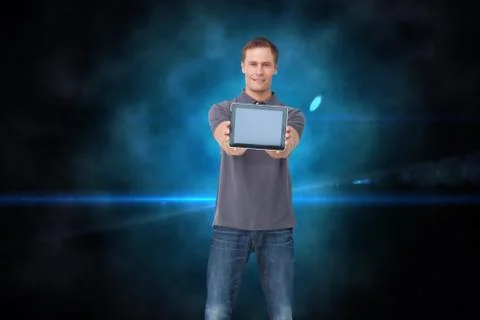 Composite image of young man showing screen of his tablet computer Illustrazione stock