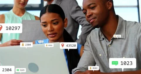 Composite of notification icons with changing numbers over diverse colleagues Stock Photos
