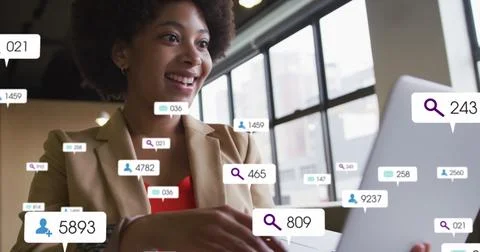 Composite of social media data processing over african american businesswoman Stock Photos