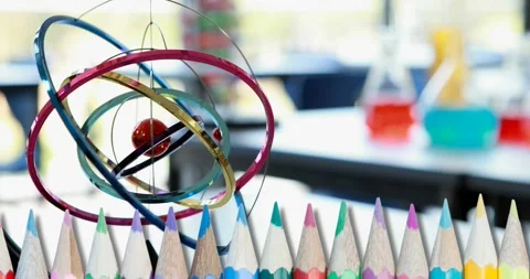 Composite video of multiple colored pencils against empty laboratory at school Video stock 173405541